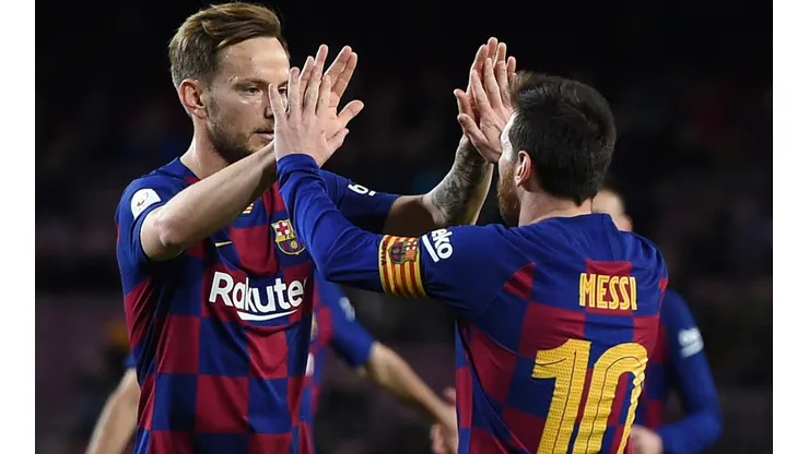 Barcelona's Ivan Rakitic (left) and Lionel Messi celebrate during a match (Getty).