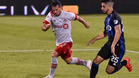 Toronto FC's Pablo Piatti gets past Emanuel Maciel of Montreal Impact. (Getty)