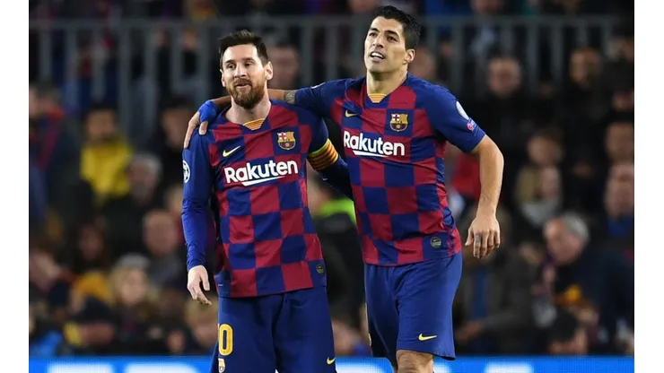 Barcelona's Luis Suárez (right) celebrates with teammate Lionel Messi after scoring a goal (Getty).