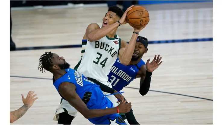 Giannis Antetokounmpo drives through the lane for a layup. (Getty)