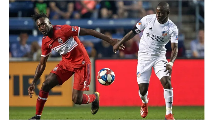C.J. Sapong of Chicago Fire (left) battling for the ball with Kekuta Manneh. (Getty)
