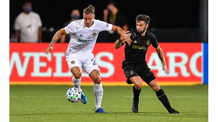 LAFC vs. LA Galaxy: Rolf Feltscher of LA Galaxy (left) turns away from Diego Rossi of LAFC (Getty).