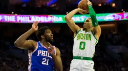 Jayton Tatum shoots over Joel Embiid. (Getty)