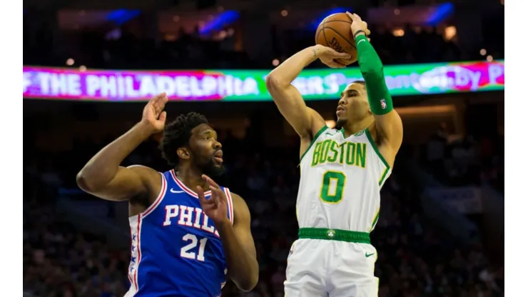 Jayton Tatum shoots over Joel Embiid. (Getty)