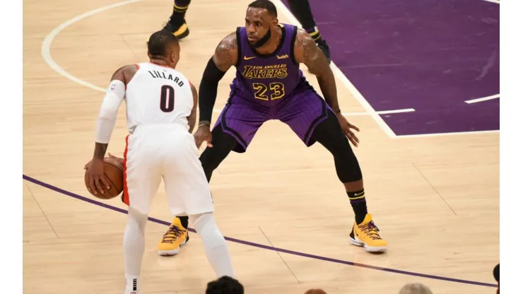 LeBron James guarding Damian Lillard. (Getty)