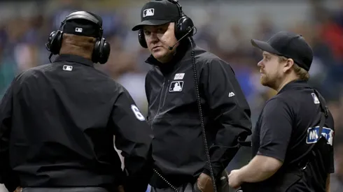 MLB umpires reviewing a call. (Getty)