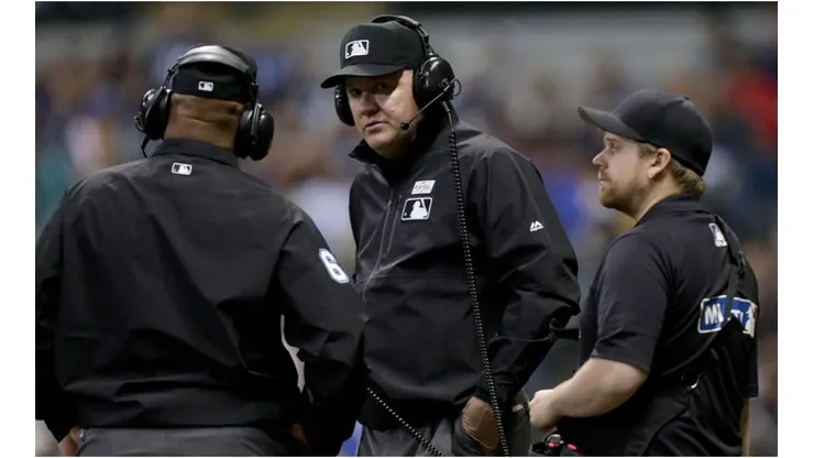 MLB umpires reviewing a call. (Getty)
