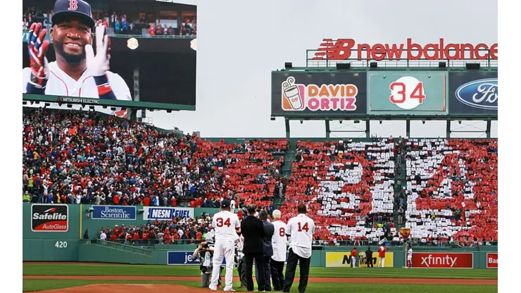 Boston Red Sox's David Ortiz beamed and clapped as fans held cards that made a giant "34" (Getty).