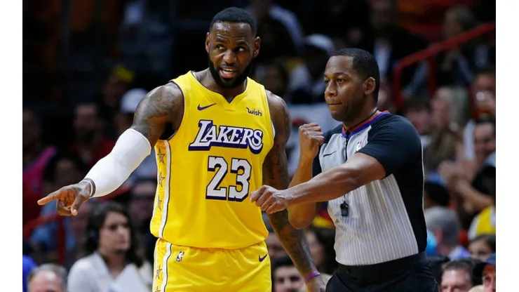 LeBron James arguing with referee Mitchell Ervin. (Getty)