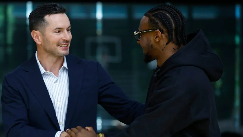 Head coach JJ Redick greets Bronny James #9 of the Los Angeles Lakers before a press conference. Ronald Martinez/Getty Images