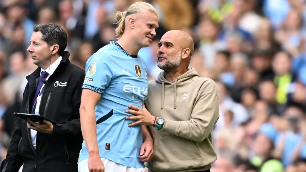 Erling Haaland of Manchester City celebrates scoring his team’s fourth goal and his hat-trick with Pep Guardiola, Manager of Manchester City, during the Premier League match between Manchester City FC and Ipswich Town FC at Etihad Stadium on August 24, 2024 in Manchester, England. (Photo by Michael Regan/Getty Images)