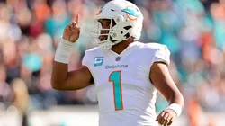 Tua Tagovailoa #1 of the Miami Dolphins celebrates a touchdown during the first half in the game against the Chicago Bears at Soldier Field on November 06, 2022 in Chicago, Illinois.