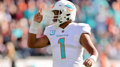 Tua Tagovailoa #1 of the Miami Dolphins celebrates a touchdown during the first half in the game against the Chicago Bears at Soldier Field on November 06, 2022 in Chicago, Illinois.