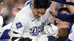 Shohei Ohtani #17 of the Los Angeles Dodgers celebrates with teammates after hitting a walk-off grand slam home run during the ninth inning against the Tampa Bay Rays at Dodger Stadium on August 23, 2024 in Los Angeles, California.