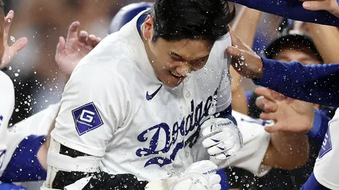 Shohei Ohtani #17 of the Los Angeles Dodgers celebrates with teammates after hitting a walk-off grand slam home run during the ninth inning against the Tampa Bay Rays at Dodger Stadium on August 23, 2024 in Los Angeles, California.