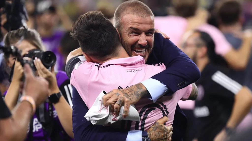 Co-owner David Beckham hugs Lionel Messi #10 of Inter Miami after defeating Nashville SC. Tim Nwachukwu/Getty Images