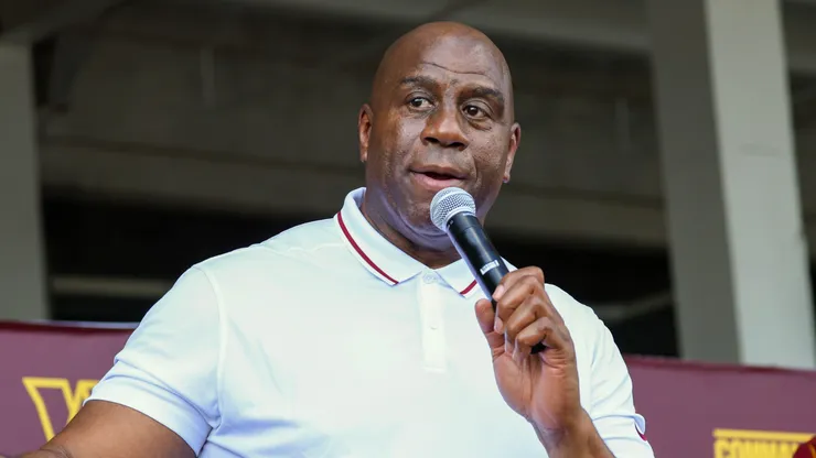 Earvin 'Magic' Johnson, a new owner of the Washington Commanders, delivers remarks during a press conference introducing the team's new ownership.