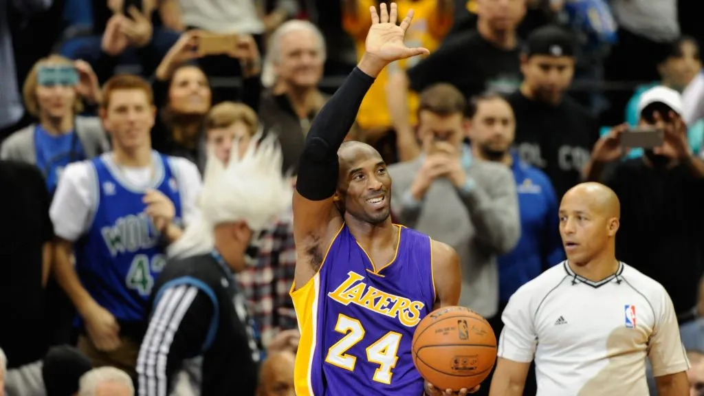 Kobe Bryant #24 of the Los Angeles Lakers waves to the crowd after passing Michael Jordan on the all-time scoring list with a free throw in the second quarter of the game on December 14, 2014 at Target Center in Minneapolis, Minnesota. (Photo by Hannah Foslien/Getty Images)
