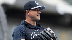 Manager Aaron Boone #17 of the New York Yankees plays catch before a game against the Chicago White Sox at Guaranteed Rate Field.
