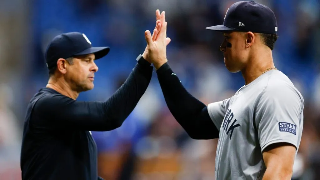 Manager Aaron Boone #17 and Aaron Judge #99 of the New York Yankees celebrate a 2-1 win over the Tampa Bay Rays at Tropicana Field on July 10, 2024 in St Petersburg, Florida. (Photo by Douglas P. DeFelice/Getty Images)
