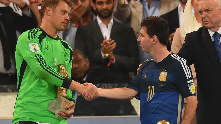 Golden Glove winner Manuel Neuer of Germany shakes hands with Golden Ball winner Lionel Messi of Argentina after Germany's 1-0 win in extra time during the 2014 FIFA World Cup Brazil Final match between Germany and Argentina at Maracana on July 13, 2014 in Rio de Janeiro, Brazil.