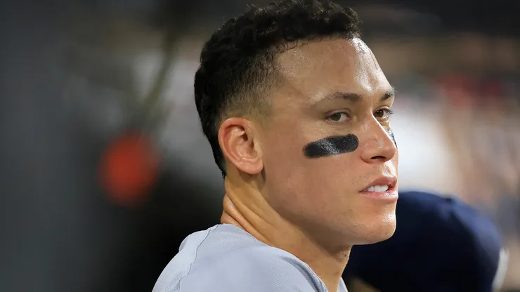 Aaron Judge #99 of the New York Yankees looks on from the dugout during the seventh inning against the Chicago White Sox at Guaranteed Rate Field on August 14, 2024 in Chicago, Illinois.
