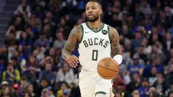 Damian Lillard #0 of the Milwaukee Bucks dribbles the ball against the Golden State Warriors