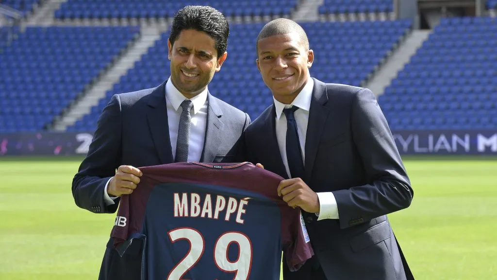 Paris Saint-Germain President Nasser Al Khelaifi poses alongside Kylian Mbappe. Aurelien Meunier/Getty Images
