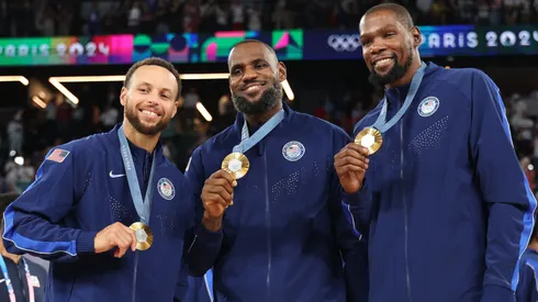 Stephen Curry, LeBron James, and Kevin Durant of Team United States pose for a photo during the Men's basketball medal ceremony on day fifteen of the Olympic Games Paris 2024 at Bercy Arena on August 10, 2024 in Paris, France.