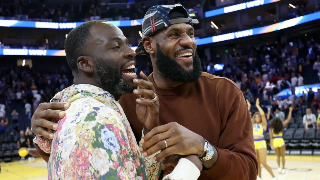 Draymond Green #23 of the Golden State Warriors hugs LeBron James #23 of the Los Angeles Lakers after their game at Chase Center