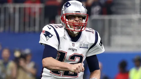 Tom Brady #12 of the New England Patriots celebrates his teams fourth quarter touchdown against the Los Angeles Rams during Super Bowl LIII at Mercedes-Benz Stadium on February 03, 2019 in Atlanta, Georgia.
