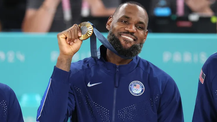 LeBron James #6 of Team United States celebrates on the podium during the Men's basketball medal ceremony on day fifteen of the Olympic Games Paris 2024 at Bercy Arena on August 10, 2024 in Paris, France.