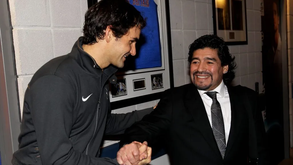 Roger Federer of Switzerland (L) and Former Argentinian footballer Diego Maradona. Clive Brunskill/Getty Images