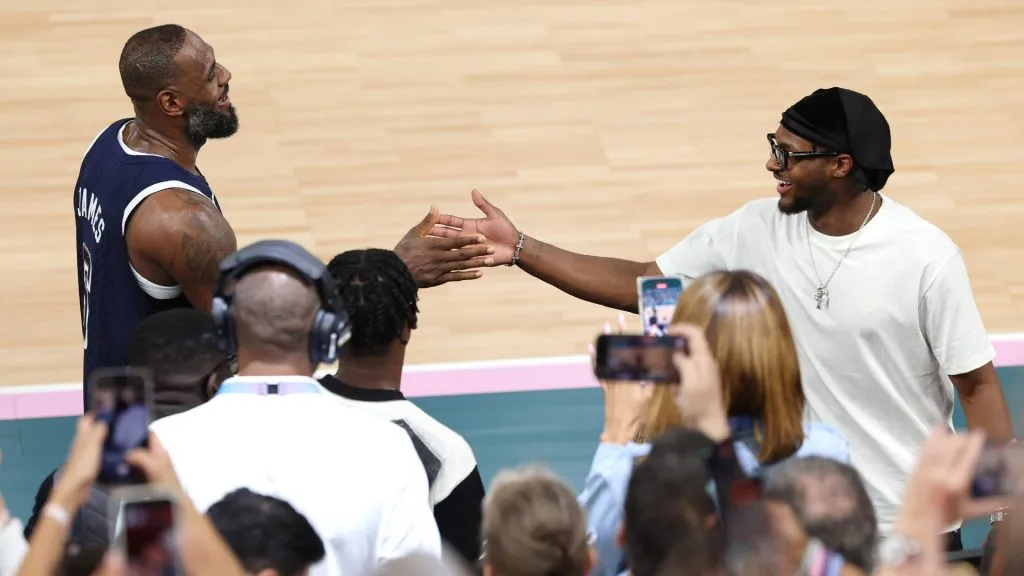 LeBron James #6 of Team United States high fives his son and NBA player Bronny James. Jamie Squire/Getty Images