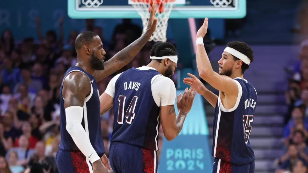Lebron James #6 high fives Devin Booker #15 of Team United States. Gregory Shamus/Getty Images