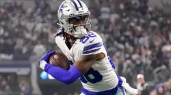 CeeDee Lamb #88 of the Dallas Cowboys carries the ball for a touchdown against the Philadelphia Eagles during the second quarter at AT&T Stadium on December 24, 2022 in Arlington, Texas.