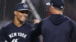 Juan Soto #22 of the New York Yankees talks with manager Aaron Boone before the MLB game against the Arizona Diamondbacks at Chase Field on April 01, 2024 in Phoenix, Arizona.