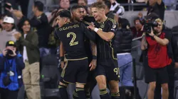 Denis Bouanga celebrates with his teammates.