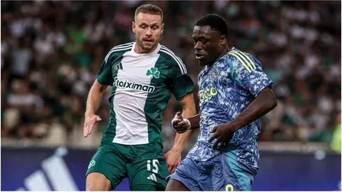 Brian Brobbey of AFC Ajax dribbles while Sverrir Ingi Ingason of Panathinaikos FC