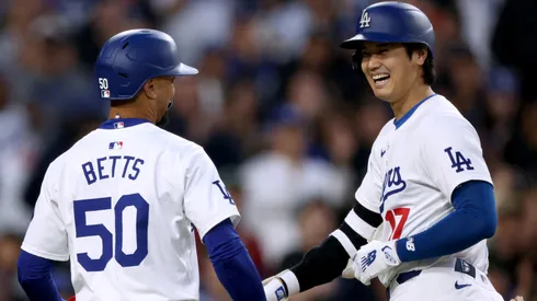 Shohei Ohtani #17 of the Los Angeles Dodgers celebrates his two run home run with Mookie Betts #50, to take a 3-0 lead over the Cincinnati Reds, during the third inning at Dodger Stadium.