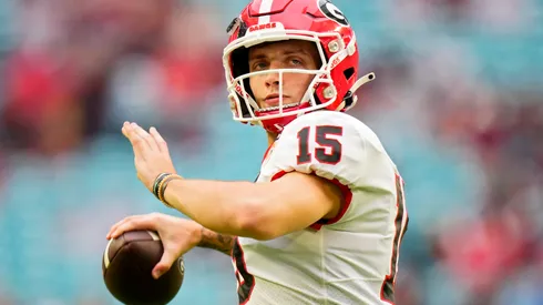 Carson Beck #15 of the Georgia Bulldogs warms up before the Capital One Orange Bowl against the Florida State Seminoles at Hard Rock Stadium on December 30, 2023 in Miami Gardens, Florida.