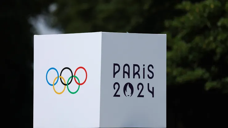 A detailed view of the Paris 2024 Olympics logo on a podium during an Equestrian Eventing training session