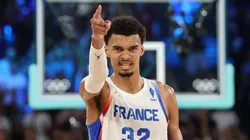 Victor Wembanyama #32 of Team France reacts after a play during a Men's basketball semifinals match between Team France and Team Germany on day thirteen of the Olympic Games Paris 2024 at Bercy Arena on August 08, 2024 in Paris, France.