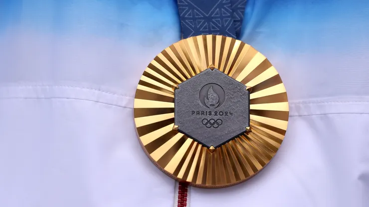 A detailed view of the gold medal of Sihyeon Lim of Team Republic of Korea, (obscured) on the podium after the Women’s Individual Archery competition on day eight of the Olympic Games Paris 2024 at Esplanade Des Invalides on August 03, 2024 in Paris, France.