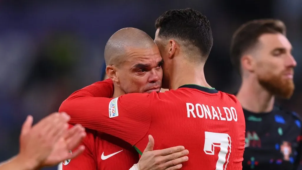 Pepe of Portugal is consoled by teammate Cristiano Ronaldo following the team's defeat in the penalty shoot out during the UEFA EURO 2024 quarter-final match between Portugal and France at Volksparkstadion on July 05, 2024 in Hamburg, Germany.