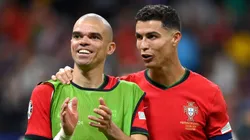 Pepe and Cristiano Ronaldo of Portugal celebrate following the team's victory in the penalty shoot out during the UEFA EURO 2024 round of 16 match between Portugal and Slovenia at Frankfurt Arena on July 01, 2024 in Frankfurt am Main, Germany.