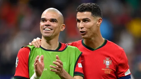 Pepe and Cristiano Ronaldo of Portugal celebrate following the team's victory in the penalty shoot out during the UEFA EURO 2024 round of 16 match between Portugal and Slovenia at Frankfurt Arena on July 01, 2024 in Frankfurt am Main, Germany.