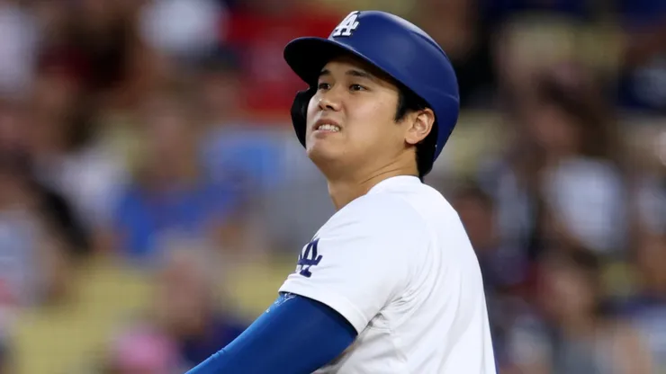 Shohei Ohtani #17 of the Los Angeles Dodgers reacts to his sly out during the third inning against the Philadelphia Phillies at Dodger Stadium on August 06, 2024 in Los Angeles, California.