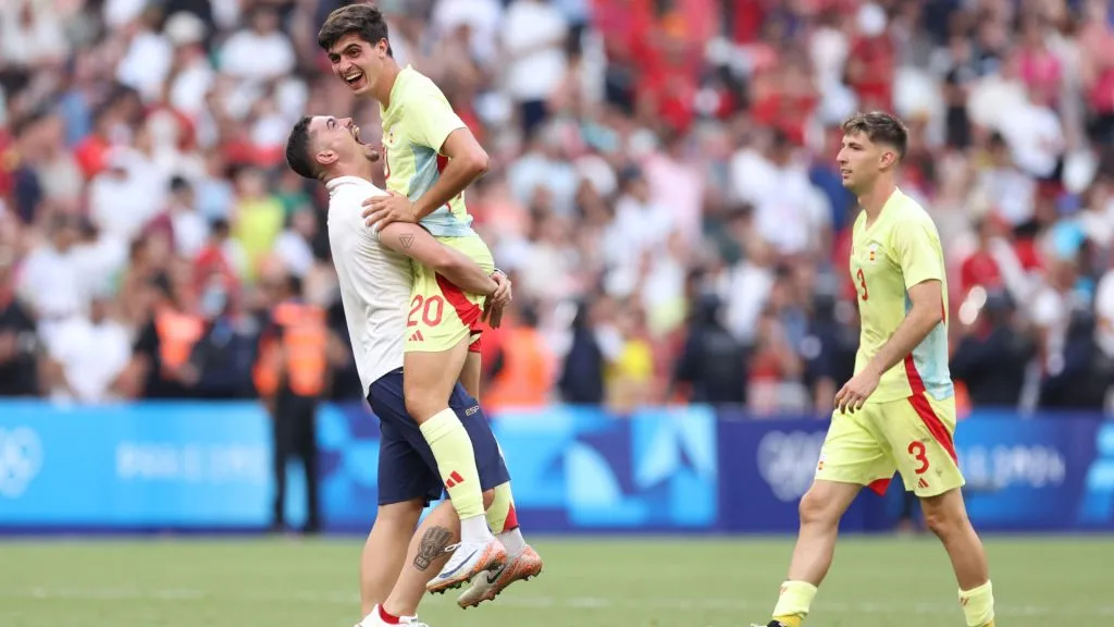 Juanlu Sanchez #20 of Team Spain celebrates with teammate victory after the Menâs semifinal match between Morocco and Spain during the Olympic Games Paris 2024. Alex Livesey/Getty Images