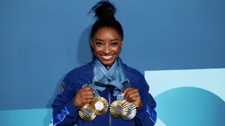 Simone Biles of Team United States poses with her Paris 2024 Olympic medals following the Artistic Gymnastics Women's Floor Exercise Final.